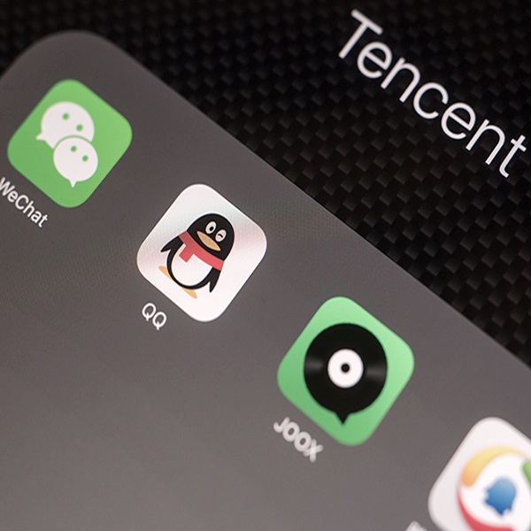What is Tencent’s strategy to expand in overseas markets?